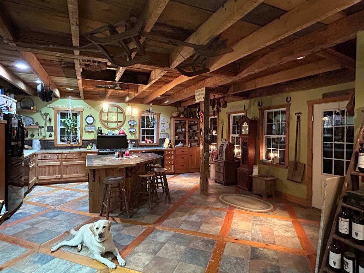 Farm house kitchen with Finn the yellow lab sitting on the tile floor